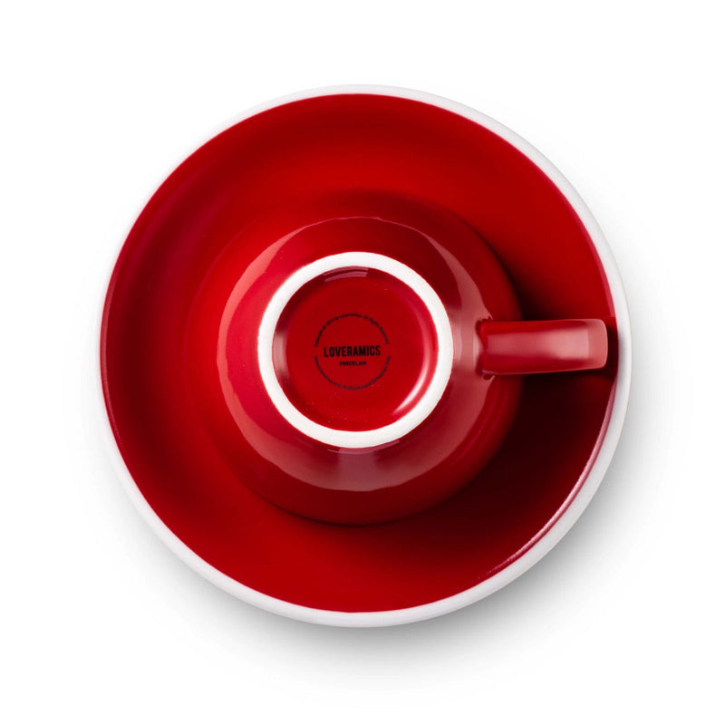 red egg shaped latte cup and saucer