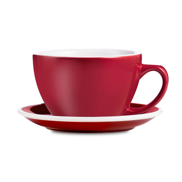 red egg shaped latte cup and saucer