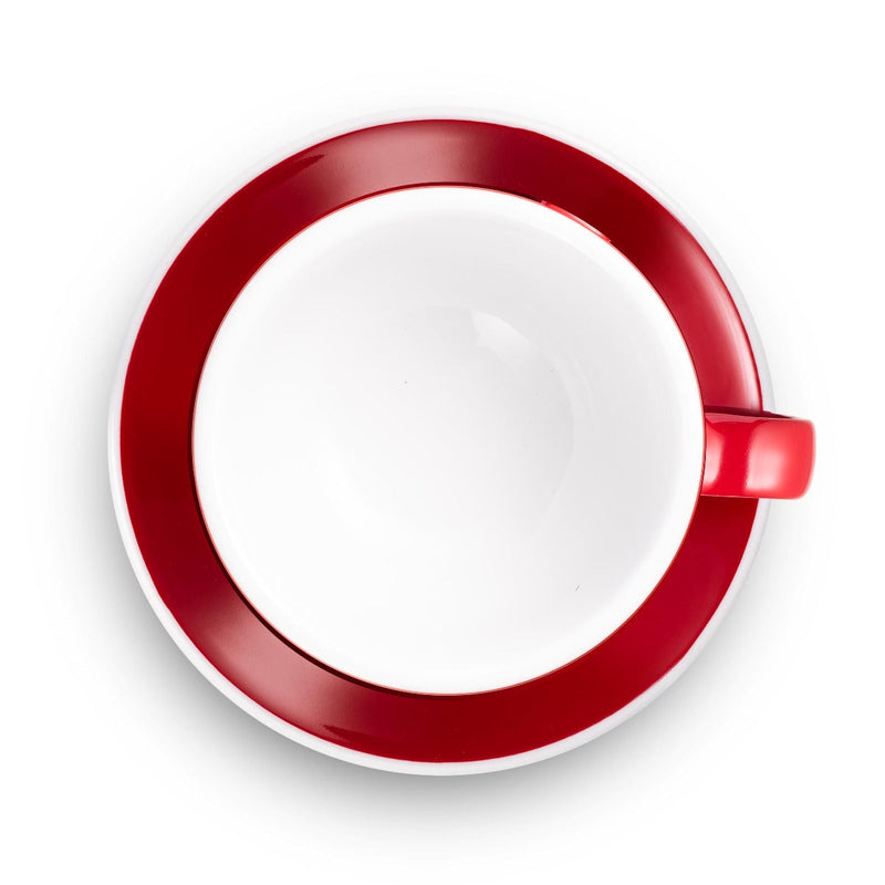 red egg shaped latte cup and saucer